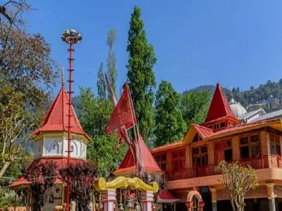 Naina Devi Temple in Nainital with colorful flags and scenic lake backdrop