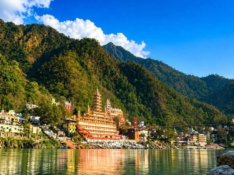 Rishikesh river view with temple and mountains in Uttarakhand