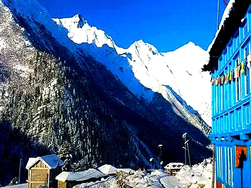 Scenic Himachal border road with snow mountains and clear blue sky