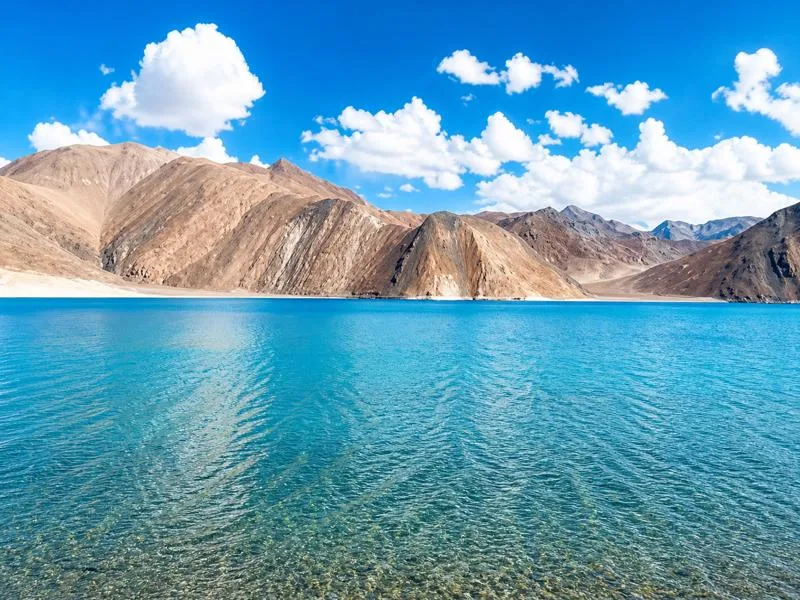 Beautiful Pangong Lake view in Ladakh with mountains and blue sky